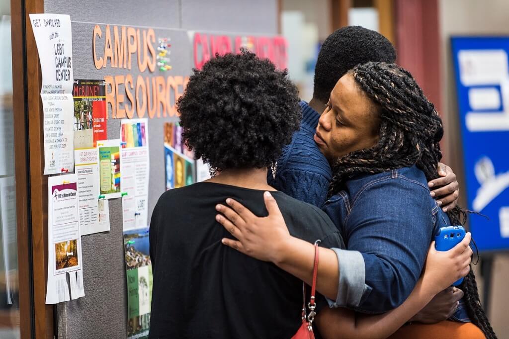 Karla Foster, coordinator for African American Student Academic Services, comforts students after a May announcement that no charges would be brought related to the death of Tony Robinson, an African-American Madison man shot by a Madison police officer.