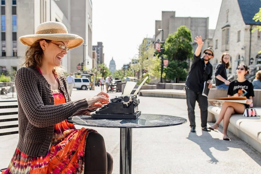 In an unexpected display of multitasking, Sarah Krause, an artist’s model, uses a manual typewriter while sitting on Library Mall for assistant professor Leslie Smith III’s life drawing class.