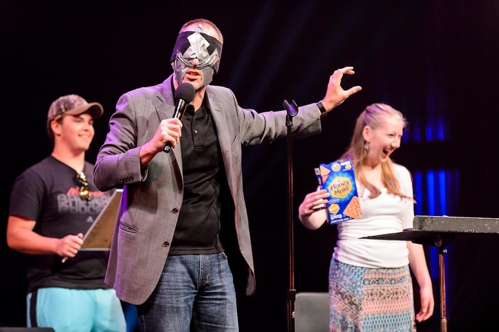 Wow! Students react with amazement as a blindfolded mentalist identifies items collected from the audience during a Wisconsin Welcome event held at the Overture Center.