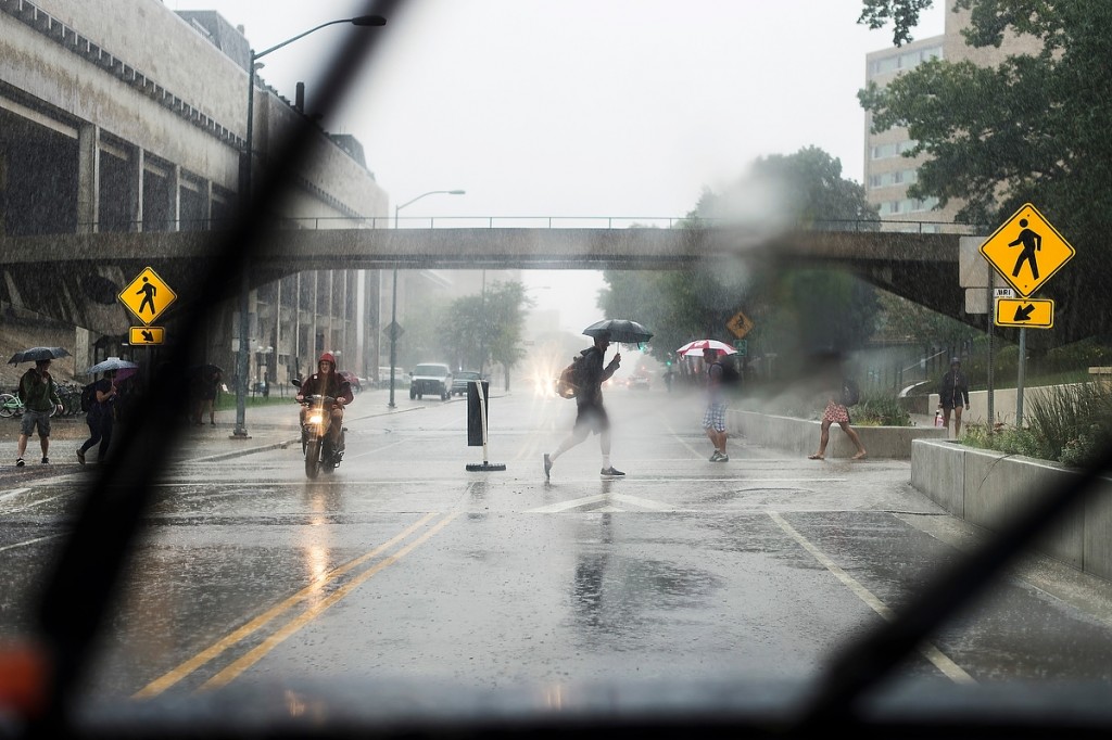 Thanks go to umbrella makers as pedestrians hustle through heavy rain on Park Street during a stormy September morning.