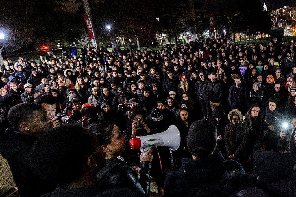 Undeterred by a blustery November night, hundreds of UW students and community members gather on Bascom Hill for a Black Out March held to support African-American students at the University of Missouri.