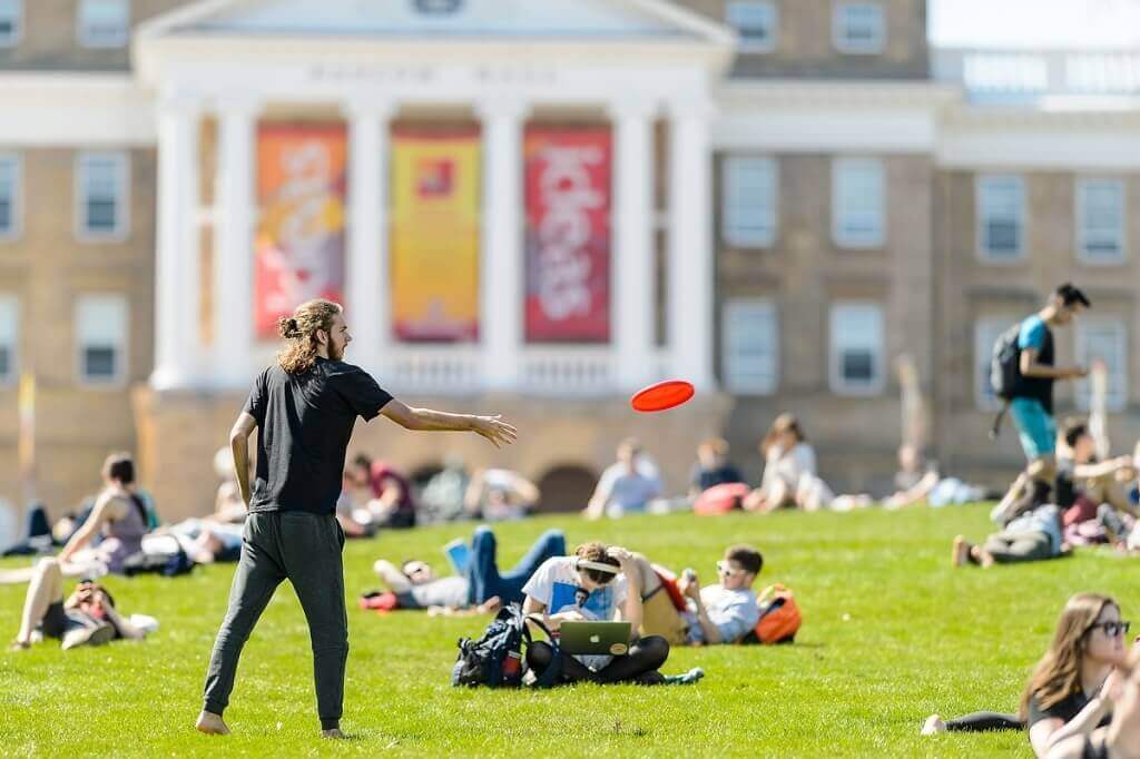 Photo: Person throwing Frisbee on Bascom Hill