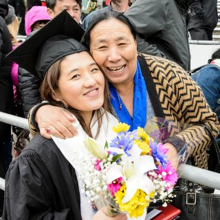 Graduate Tenzin Pema celebrates with her family.