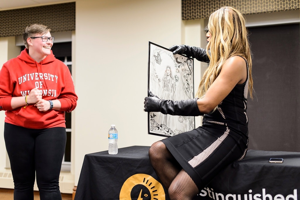 Photo: Student presenting Laverne Cox with poster