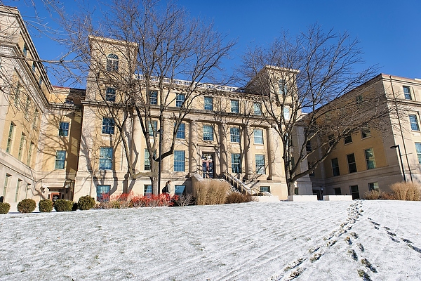 The sun shines on the snow-covered ground and Nancy Nicolas Hall at the University of Wisconsin-Madison during a chilly winter morning on Nov. 27, 2013. The building is home to the School of Human Ecology. (Photo by Jeff Miller/UW-Madison)
