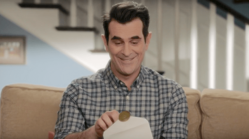 Photo: TV character Phil Dunphy opening envelope