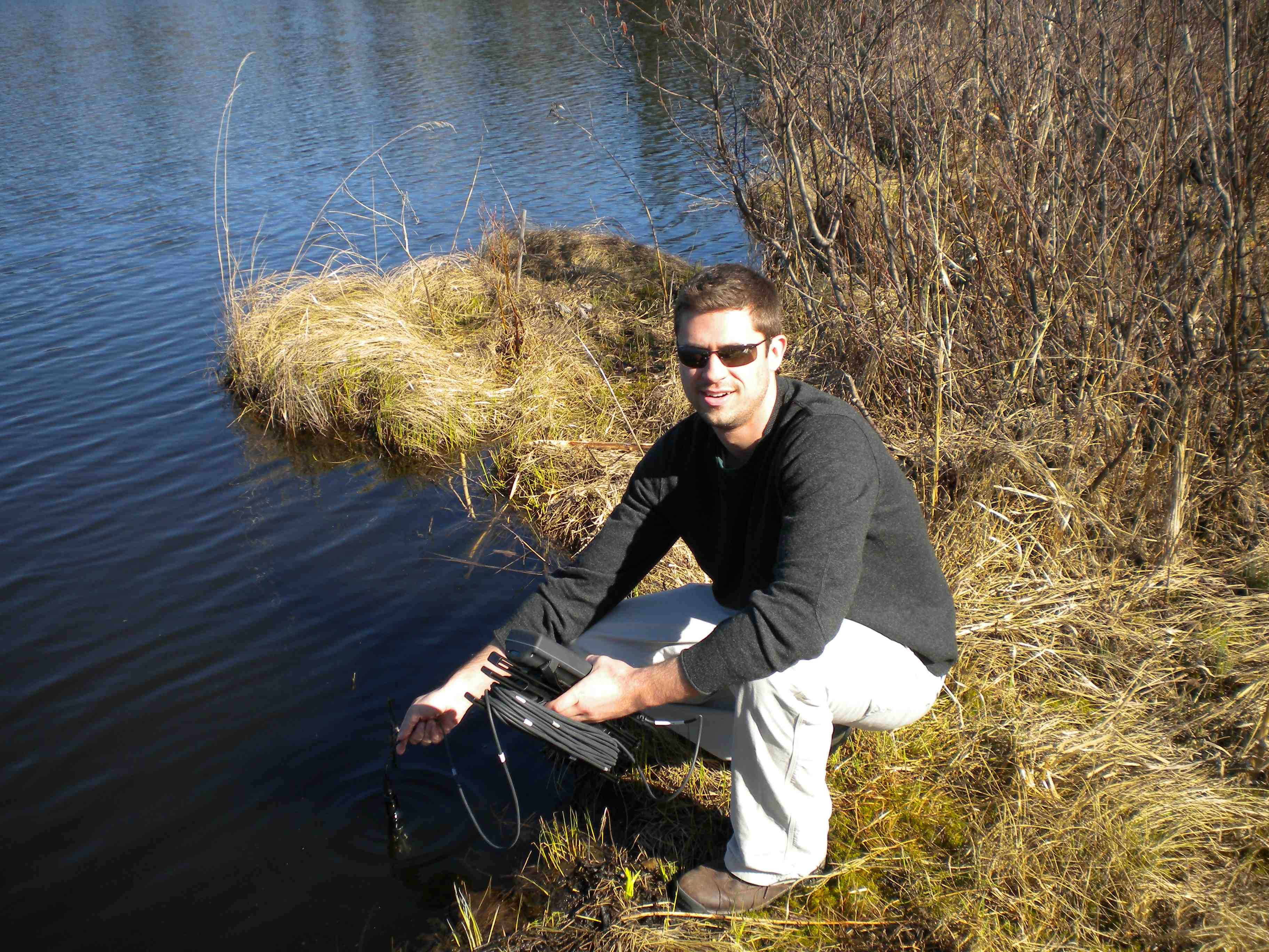 Ryan Batt takes a reading of oxygen levels in a Center for Limnology study lake in Northern Wisconsin. 