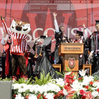 Bucky Badger joins the commencement stage party for "Jump Around."