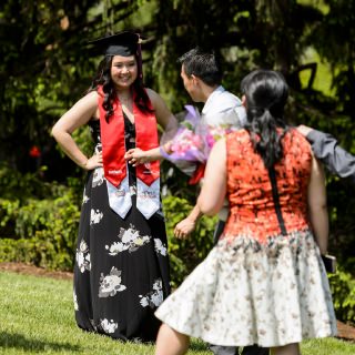 Graduate Dara Xiong is the center of attention following UW-Madison's spring commencement ceremony at Camp Randall Stadium at the University of Wisconsin-Madison on May 13, 2017. Xiong is a PEOPLE Scholar graduating with a double major in human development and family studies, and theatre and drama. The outdoor graduation is expected to be attended by more than 6,000 bachelor's and master's degree candidates, and their guests. (Photo by Jeff Miller/UW-Madison)