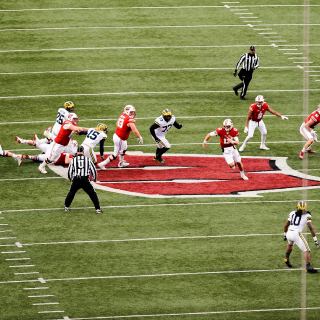 Wisconsin quarterback Alex Hornibrook (12) makes a break up the middle of the field as the Wisconsin Badgers play a football game against the Michigan Wolverines at Camp Randall Stadium at the University of Wisconsin-Madison on Nov. 18, 2017. Wisconsin won the game, 24-10. (Photo by Jeff Miller / UW-Madison)