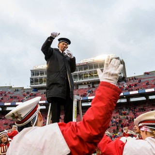 UW Marching Band Director Michael Leckrone closes out the band's fifth quarter performance of "Varsity" following the Wisconsin Badgers' 24-10 football victory over the Michigan Wolverines at Camp Randall Stadium at the University of Wisconsin-Madison on Nov. 18, 2017. (Photo by Jeff Miller / UW-Madison)