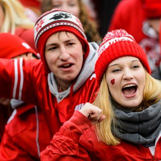 Wisconsin Badger fans cheer on Wisconsin players exiting the field following Wisconsin's 24-10 football victory over the Michigan Wolverines at Camp Randall Stadium at the University of Wisconsin-Madison on Nov. 18, 2017. (Photo by Jeff Miller / UW-Madison)