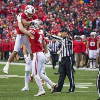 Photo of linebackers T.J. Edwards, left, and Ryan Connelly, right, celebrating the 24-10 victory over Michigan.