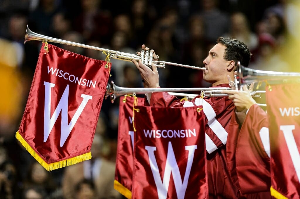 Musicians play trumpets festooned with Wisconsin banners as the ceremony begins.