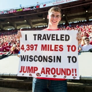 Martin Janku, a badger and Jump Around fan from the Czech Republic, holds up a sign describing his commitment during the UW Homecoming football games versus Maryland inside Camp Randall Stadium at the University of Wisconsin-Madison on Oct. 21, 2017. The Badgers won the game 38-13. (Photo by Bryce Richter / UW-Madison)