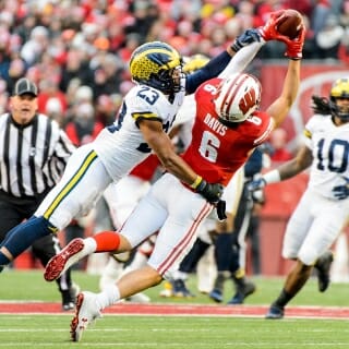 Wisconsin Badger's Danny Davis (6), wide receiver, goes up for a pass during a football game against the Michigan Wolverines at Camp Randall Stadium at the University of Wisconsin-Madison on Nov. 18, 2017. Wisconsin won the game 24-10. (Photo by Bryce Richter / UW-Madison)