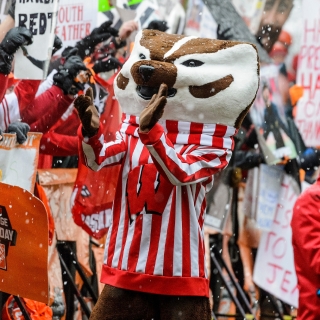 As cold rain falls, UW-Madison mascot Bucky Badger cheers on fans as ESPN College GameDay broadcast a live show on Bascom Hill at the University of Wisconsin-Madison on Nov. 18, 2017. Immediately after the show, Wisconsin play Michigan in a football game at Camp Randall Stadium. (Photo by Jeff Miller / UW-Madison)