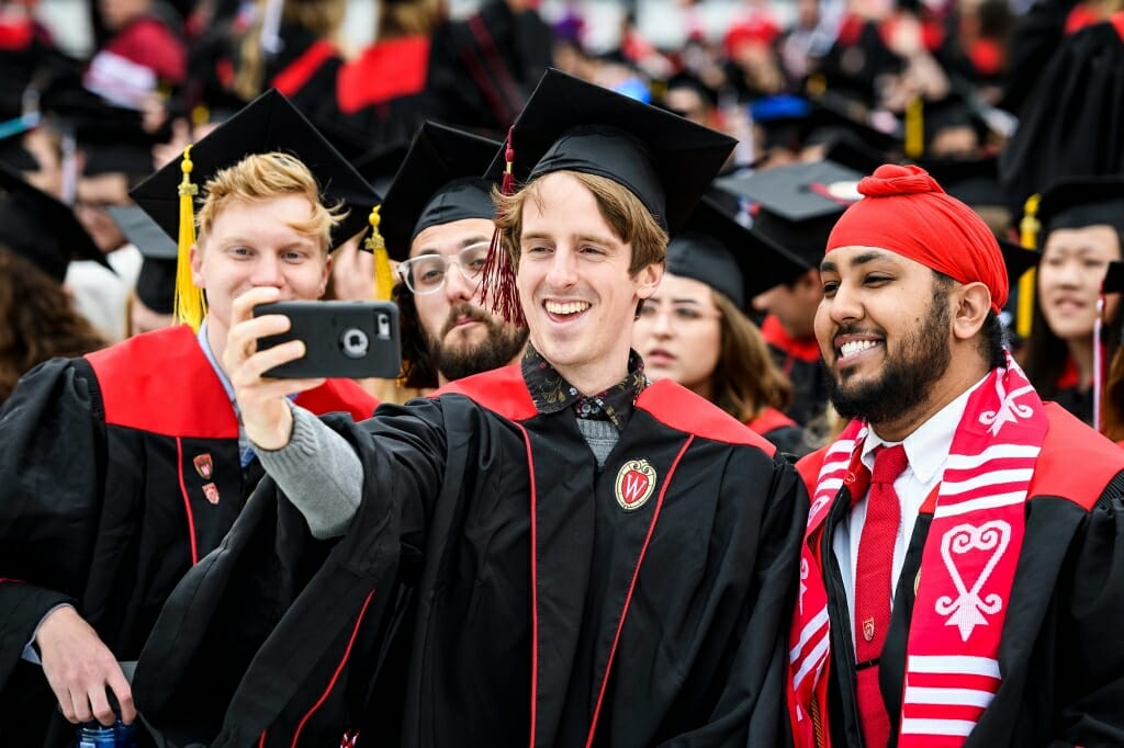 Photo of, from left to right, College of Letters and Science graduates Joseph Hushek, Roger Daley, Keegan Hasbrook and Jasdeep Kler posing for a selfie.