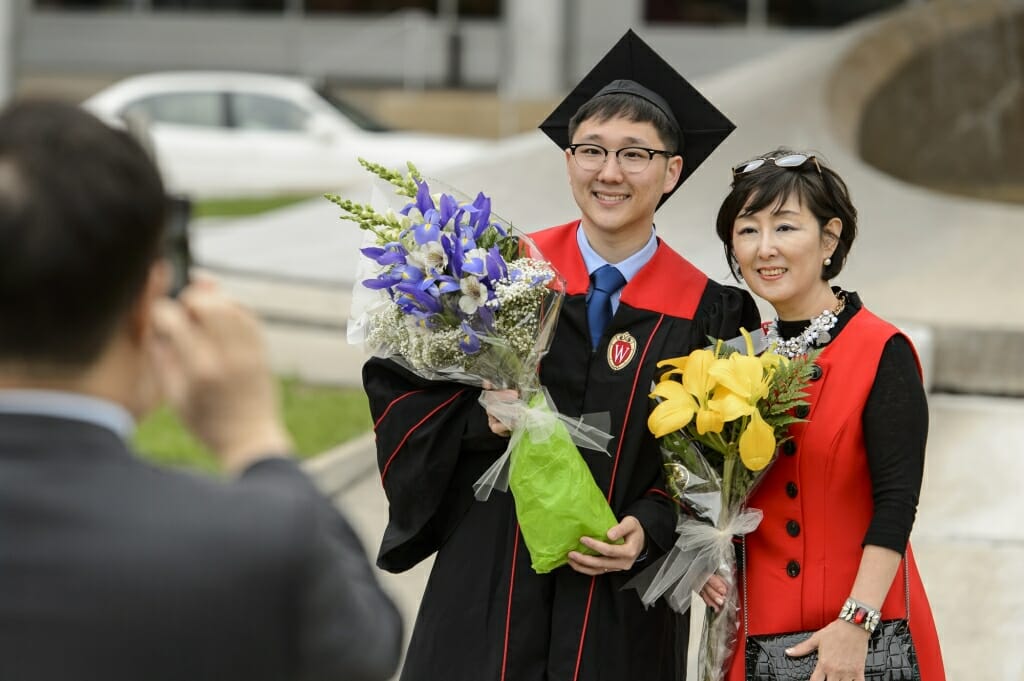 Photo of graduate David Kim posing with his mother.