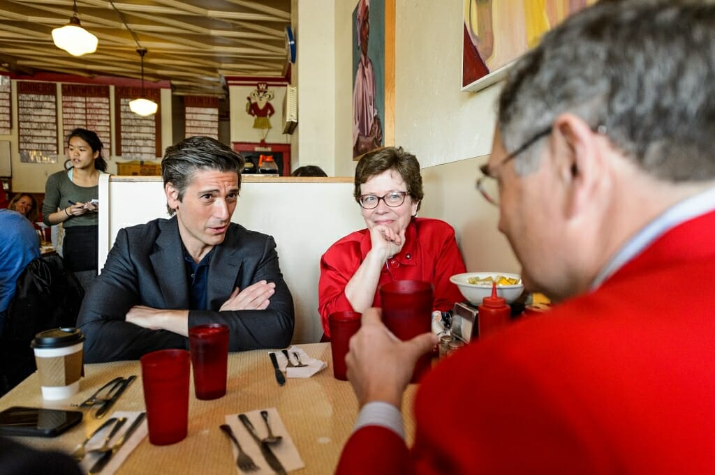 Photo of Muir enjoying breakfast with Chancellor Rebecca Blank and her husband, Hanns Kuttner, at Mickies Dairy Bar, a classic Madison diner near Camp Randall.