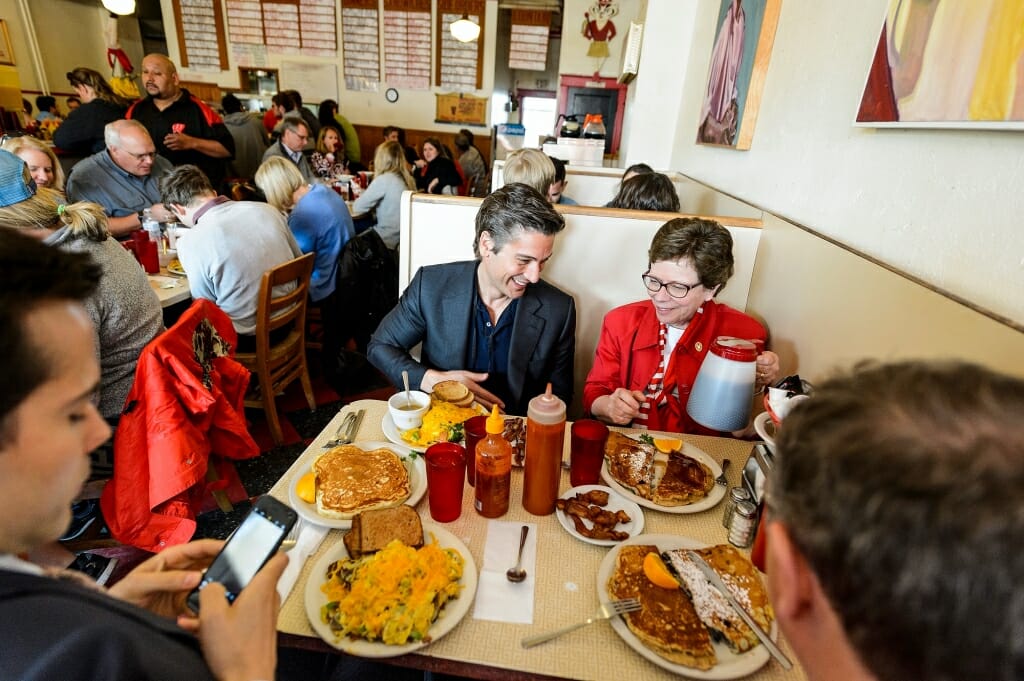 Photo of Muir, Blank and Kuttner with a table full of pancakes.