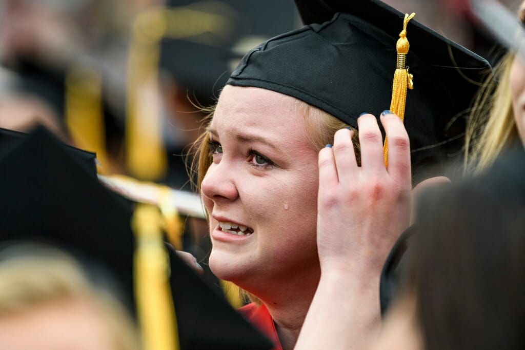 Photo of Jessica Kreuser, graduating with a bachelor's of science in nutritional sciences, shedding a tear at the ceremony's end.